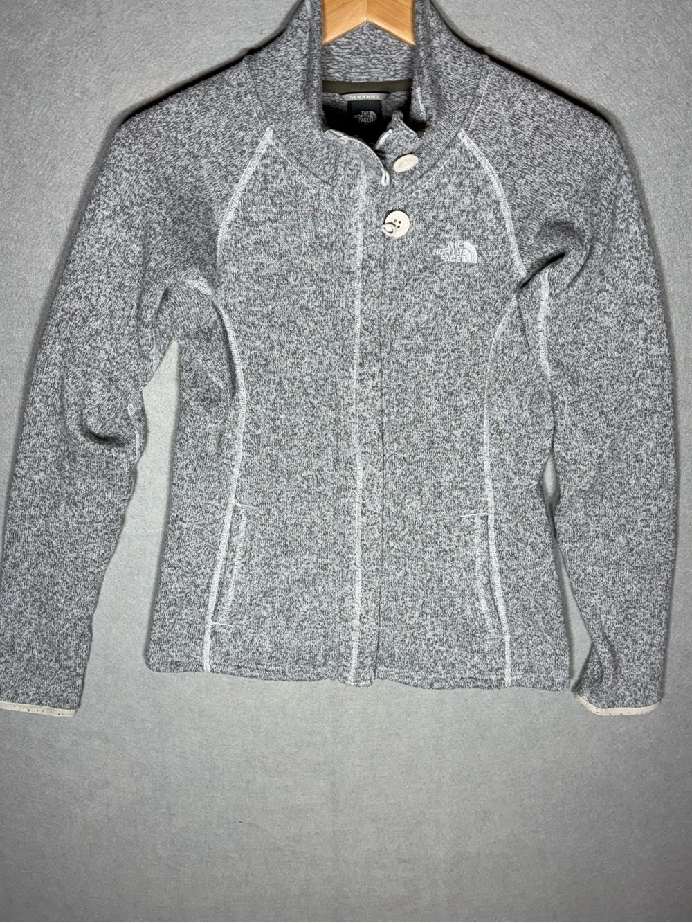 The North Face Light Gray Fleece Jacket with Black Logo Tag